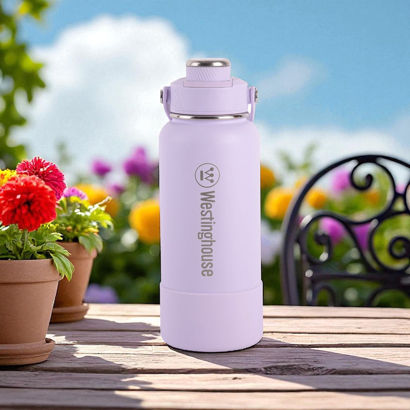 Botella térmica doble pared acero inoxidable 946 ml con boquilla y funda silicona lila · Mantiene bebidas frías y calientes